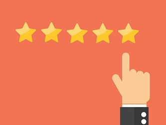 Hand pointing towards five gold stars